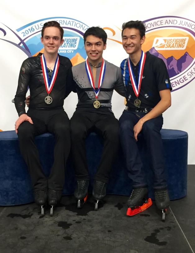 Silver medalist Mathew Graham, left, sits with gold medalist Camden Pulkinen and bronze medalist Mitchell Friess upon conclusion of the junior men’s competition at the U.S. Novice and Junior Challenge Skate on Sept. 18 in Salt Lake City. This was Graham’s best finish in four consecutive years at the event. Photo courtesy of Genny Graham